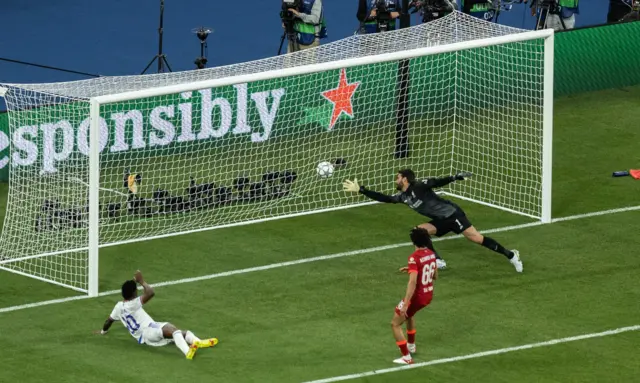 Vinicius Jr of Real Madrid scores the winner against Liverpool in the Champions League final