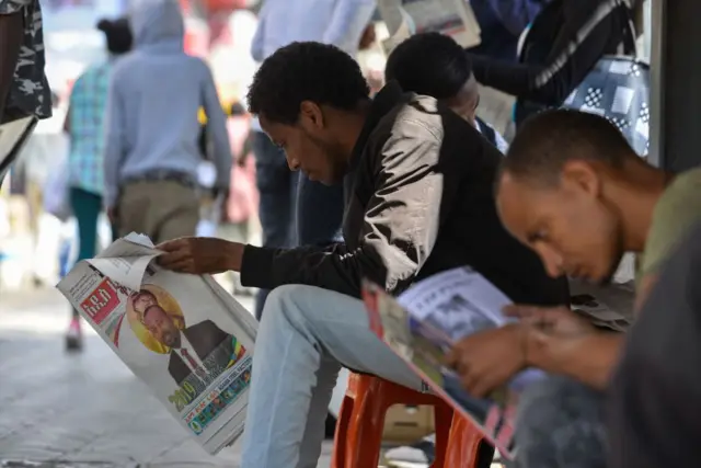 People read newspapers in Addis Ababa in 2019.