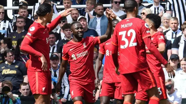 Naby Keita (second from left) celebrates scoring