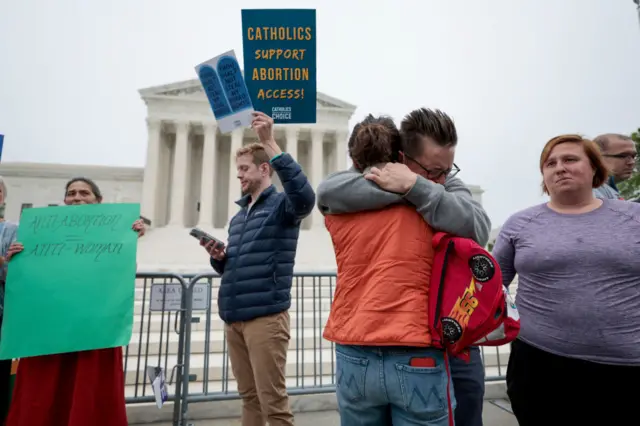 Pro-choice activists embrace as they demonstrate in front of the US Supreme Court Building on May 03, 2022 in Washington, DC.