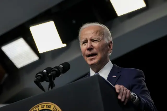 President Joe Biden (C) delivers remarks from the South Court Auditorium of the White House Complex during the virtual Presidential Rank Awards ceremony on Monday, May 2, 2022 in Washington, DC