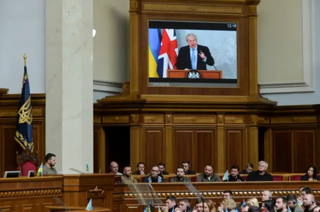 Ukraine's President Zelensky and British PM Johnson address a session of parliament, in Kyiv