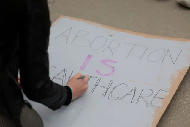 Pro-choice activists make signs in front of the U.S. Supreme Court on May 03, 2022 in Washington, DC