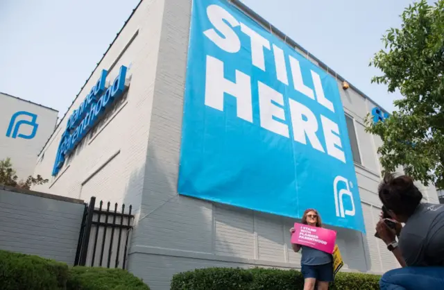 Pro-choice supporters pose for photos outside the Planned Parenthood Reproductive Health Services Center in St. Louis, Missouri, May 31, 2019