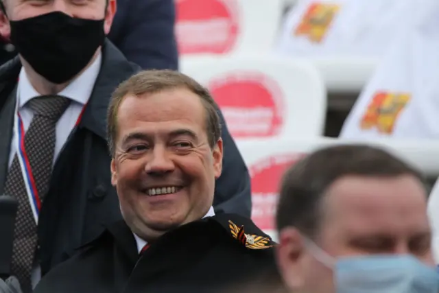 Dmitry Medvedev smiles during a military parade at Red Square earlier in May