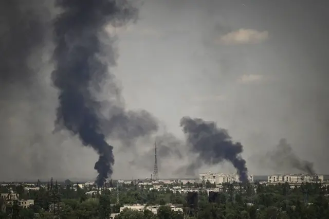 Smoke rises in the city of Severodonetsk during heavy fightings between Ukrainian and Russian troops at eastern Ukrainian region of Donbas on May 30, 2022