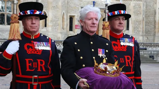 Bruno Peek returns the Jubilee Crystal Diamond, used to light the beacons in 2012, to the Tower of London