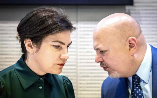 ICC prosecutor Karim Khan (R) and Ukraine's prosecutor-general Iryna Venediktova speak at the press conference