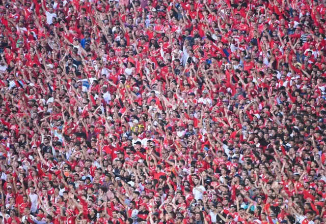 Wydad Casablanca fans celebrate in the stands.