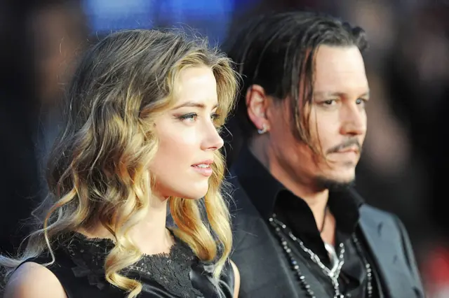 Johnny Depp (R) and Amber Heard attend the Virgin Atlantic Gala screening of "Black Mass" during the BFI London Film Festival at Odeon Leicester Square on October 11, 2015 in London, England