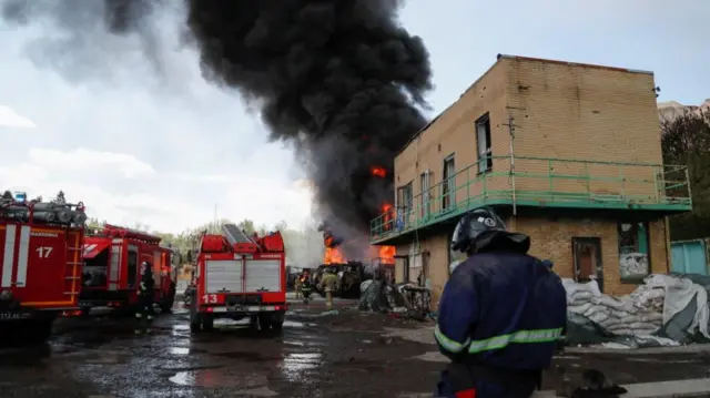 Firefighters extinguish fires at an oil depot on the outskirts of Donetsk