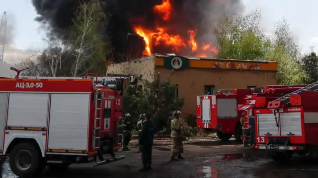 Firefighters extinguish fires at an oil depot on the outskirts of Donetsk