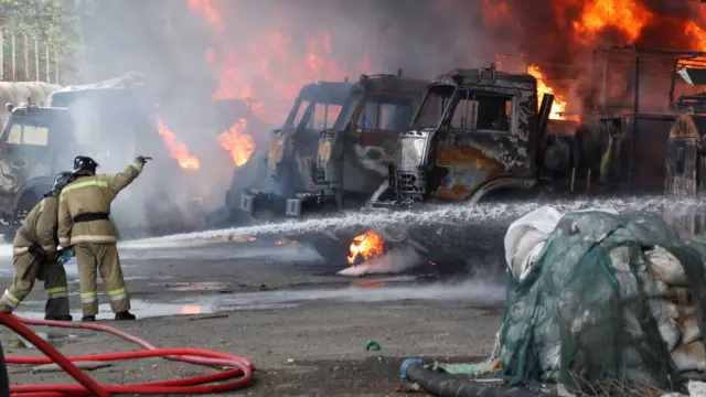 Firefighters extinguish fires at an oil depot on the outskirts of Donetsk