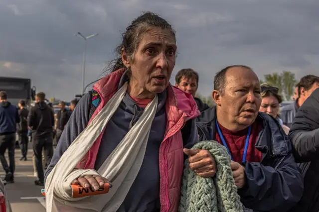 An injured female evacuee arrives in Zaporizhzhia