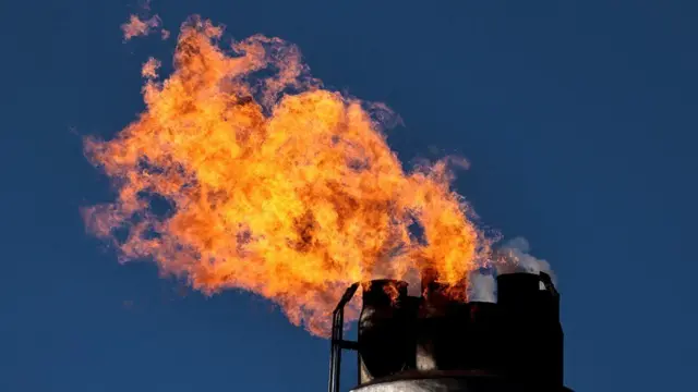 A chimney emitting fire at the Schwedt refinery