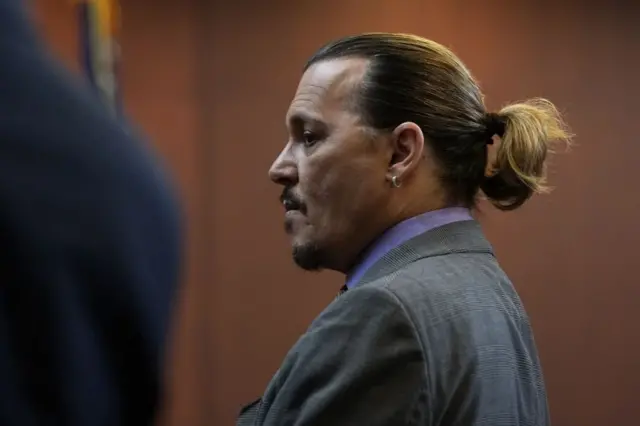 US actor Johnny Depp stands in the courtroom at the Fairfax County Circuit Court during his defamation case against ex-wife, US actress Amber Heard, in Fairfax, Virginia, on May 4, 2022