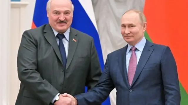 Russia's President Vladimir Putin (R) shakes hands with his Belarus counterpart Alexander Lukashenko (L) during a press conference following their talks at the Kremlin in Moscow on February 18, 2022.