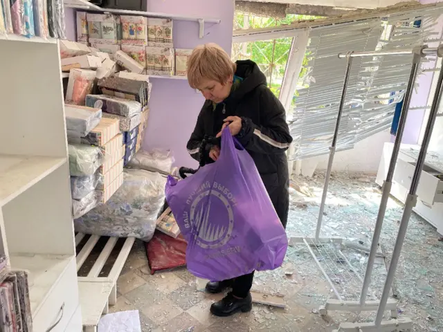 Damaged apartment blocks and shops in a residential neighbourhood of the city of Kramatorsk