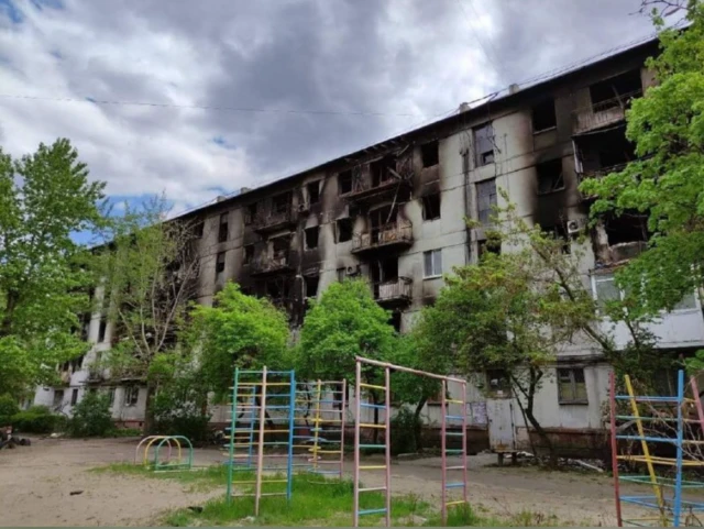 Image shows shelled buildings