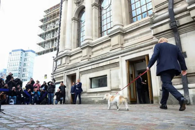 Boris Johnson walks into a polling station