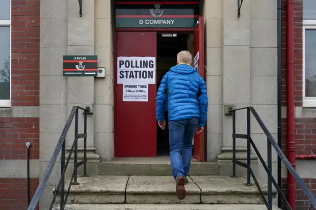 A man enters a polling station