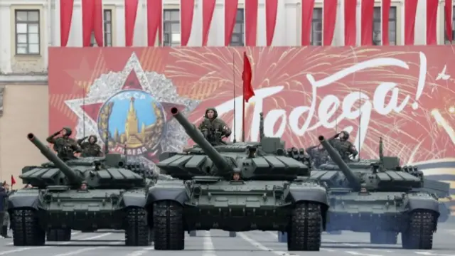 Russian military vehicles roll along Dvortsovaya Square during rehearsal of the Victory Day parade in St. Petersburg, Russia, 05 May 2022