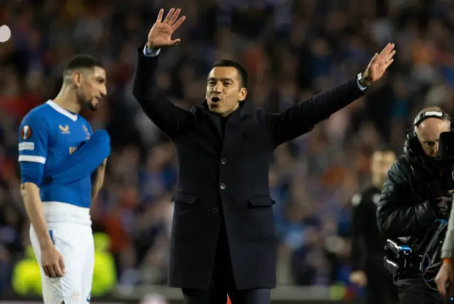 Giovanni van Bronckhorst joins in the celebrations at full-time