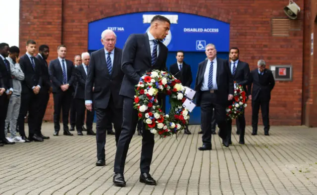 Rangers captain James Tavernier lays a wreath for Jimmy Bell at Ibrox