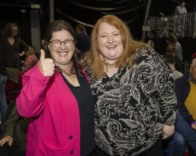 Naomi Long celebrating with her party colleague Kellie Armstrong