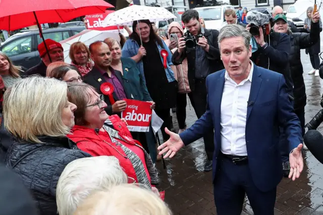 Sir Keir Starmer greets supporters in Carlisle