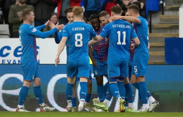 Inverness' Austin Samuels celebrates with teammates after making it 1-0