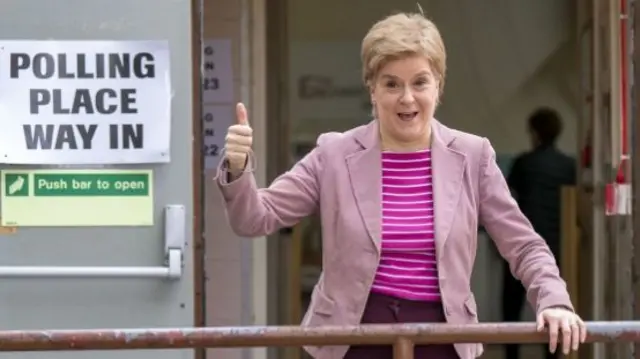 Nicola Sturgeon poses at a polling station in Glasgow