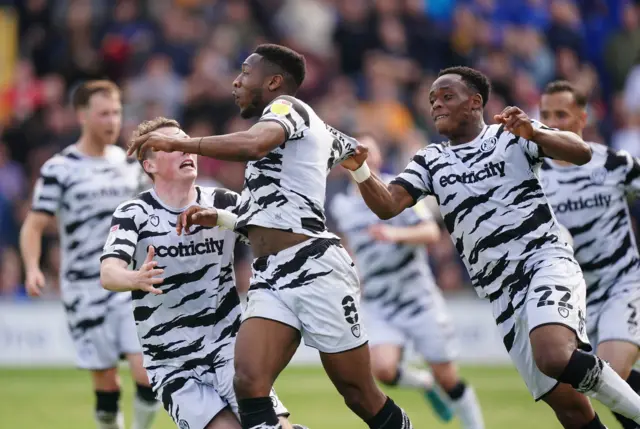 Forest Green Rovers' Ebou Adams (centre) celebrates scoring their side's first goal of the game