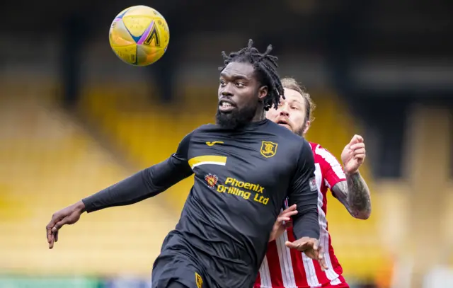 Livingston's Ayo Obileye and St Jonstone's Stevie May during a cinch Premiership match between Livingston and St Johnstone