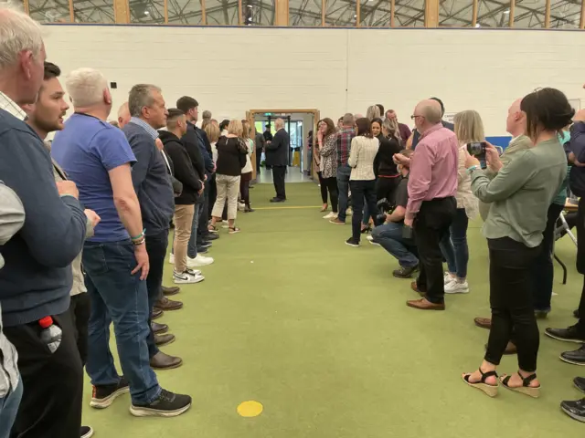 Sinn Féin supporters gather at the count centre in Magherafelt