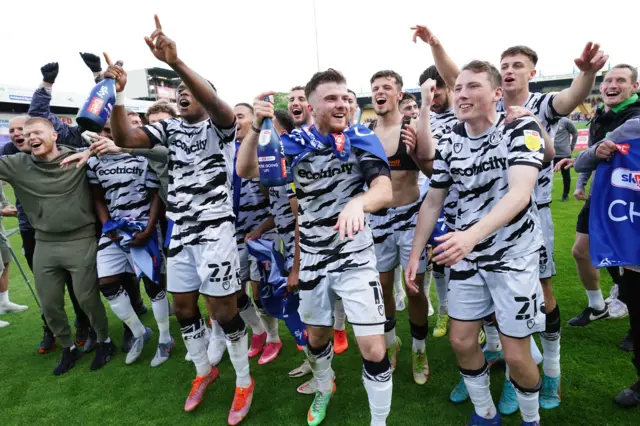 Forest Green Rovers players celebrate winning the League Two title