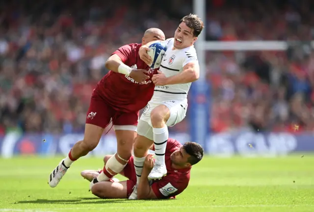 Antoine Dupont runs with the ball