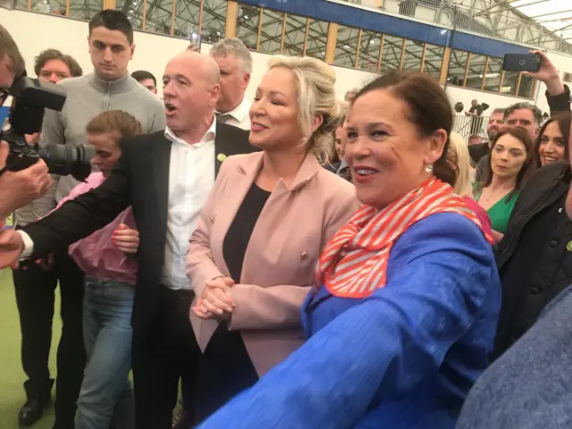 Michelle O'Neill and Mary Lou McDonald arrive in Magherafelt surrounded by people