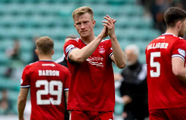 Ross McCrorie applauds travelling fans at Easter Road