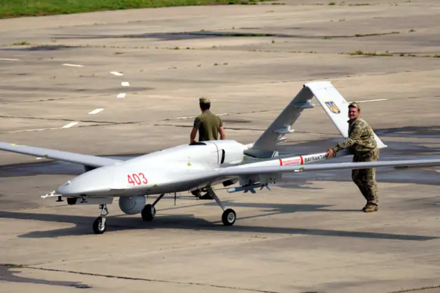 Ukrainian servicemen push a Bayraktar TB2 UCAV at the Kulbakyne aerodrome during the Exercise Sea Breeze 2021, Mykolaiv, southern Ukraine