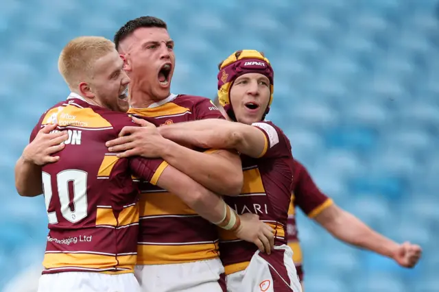 Owen Trout celebrates his try