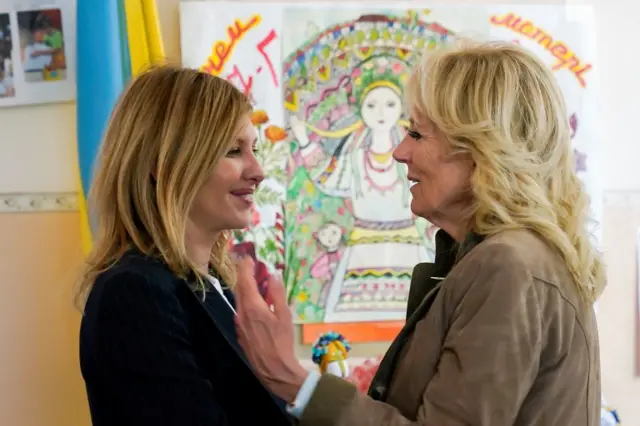 First lade Jill Biden reaches out to hug Olena Zelenska at the end of their visit to school  in the border town of Uzhhorod