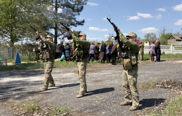 Soldiers firing a salute at funeral