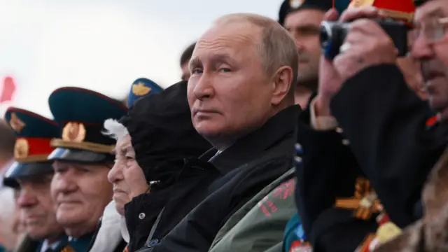 Russian President Vladimir Putin watches Victory Day parade in Moscow's Red Square