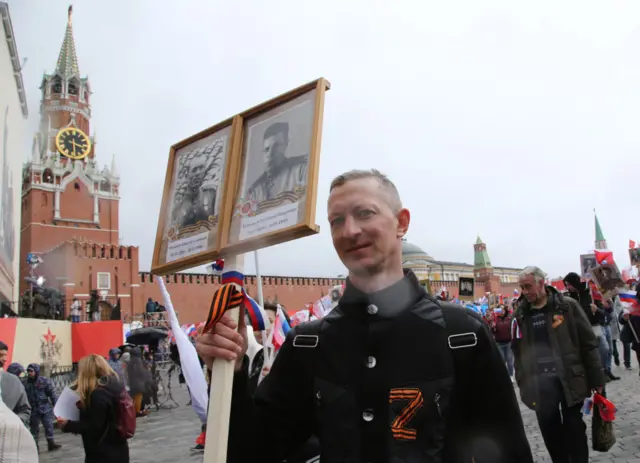 A man wearing a letter "Z", a symbol supporting the military invasion on Ukraine