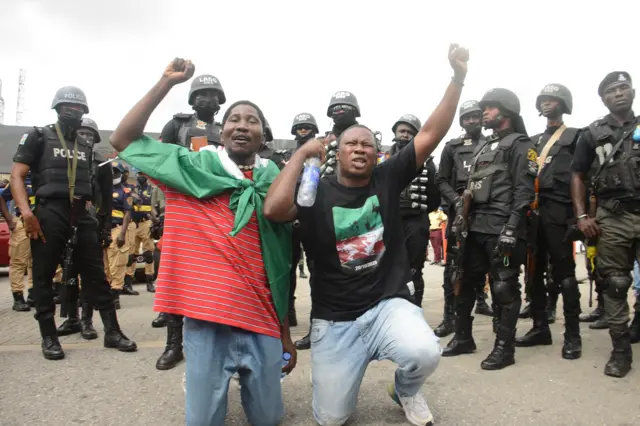 Protesters chant slogan songs during a protest to commemorate one year anniversary of #EndSars, a protest against a military attack on protesters at Lekki tollgate in Lagos, Nigeria, on October 20, 2021.