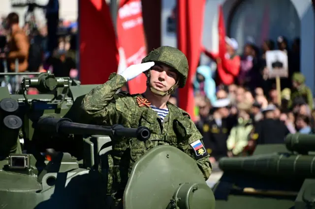 Military vehicles roll through the far eastern city of Vladivostok