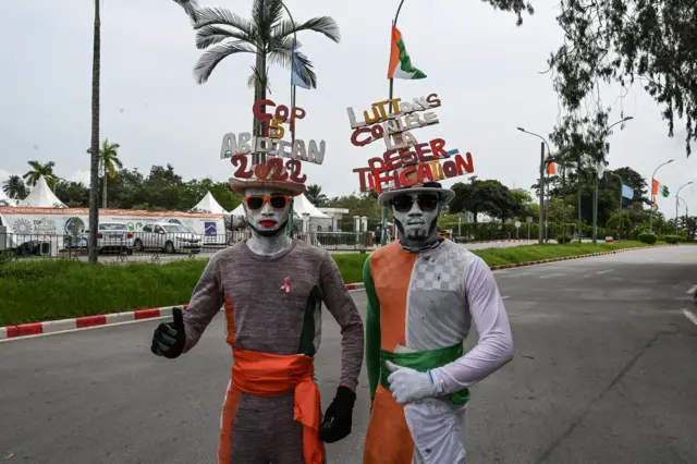 Two men dressed in Ivorian colours in Abidjan