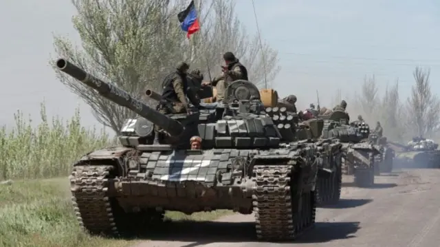 An armoured convoy of pro-Russian troops drives near Novoazovsk, Donetsk region