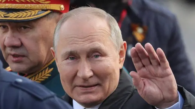 President Putin waves during Monday's Victory Day parade